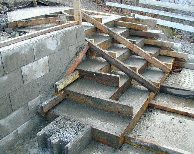 some stairs made out of wood and cement