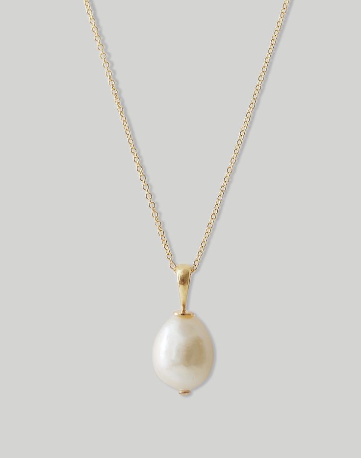 Handcrafted and made to last a lifetime, founder Jennie Yoon's sleek, sculptural jewelry are modern heirlooms. Elegantly placed on a 14k solid gold chain, The Baroque Necklace features a stunning pearl with its own indiviuality.Pendant weight: 1.8g.Pearl height: 11mm.Bail height: 6.3mm.Each pearl is unique.14k solid gold.Spot clean.Made in the USA. Simple One Pearl Necklace, Simple Gold Necklace Stack, Gold Necklace Pearl, Gold Pearl Jewelry Necklace, Grecian Jewelry, Classic Style Jewelry, Interiors 2023, Baroque Necklace, Pearl Necklace Pendant