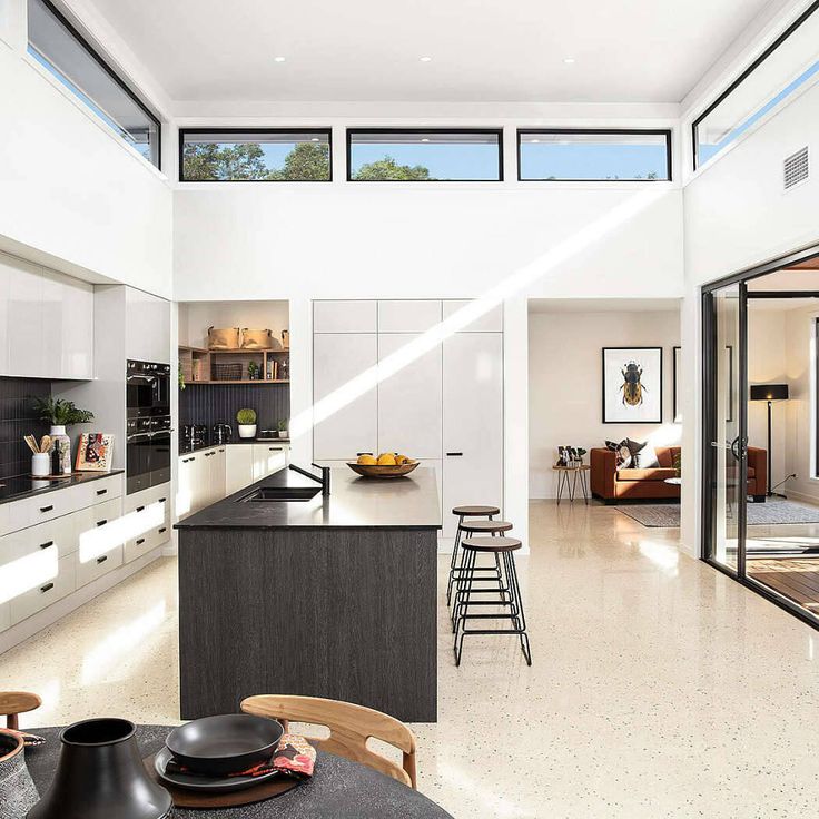 the kitchen is clean and ready to be used as a living room or dining area