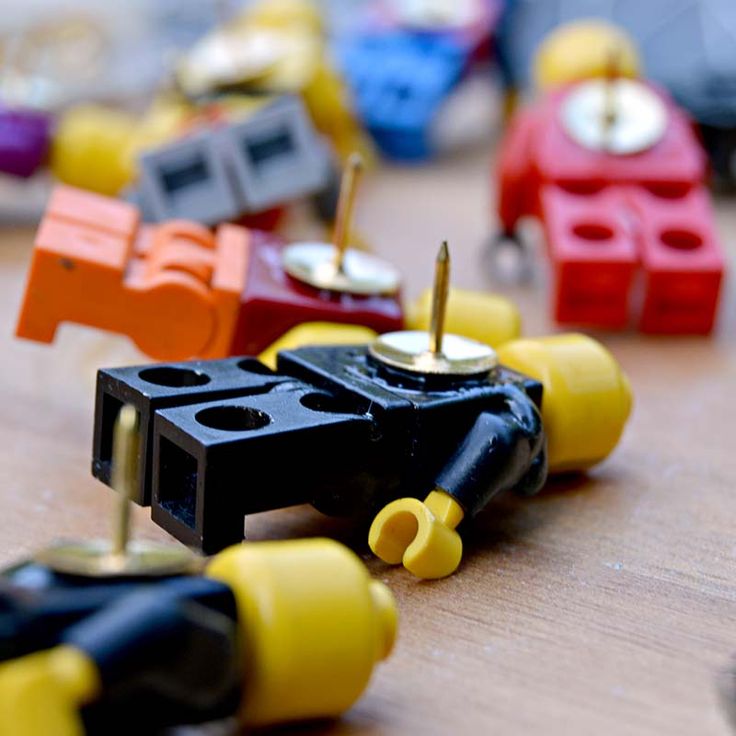 the toy cars are lined up on the table