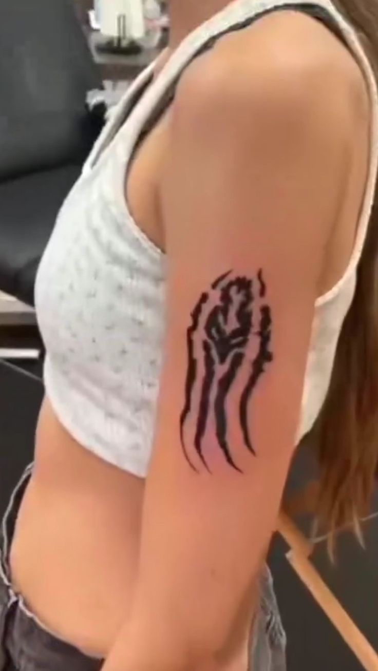 a woman with a tattoo on her arm