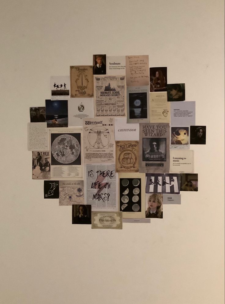 a white wall covered in lots of different types of pictures and papers on it's side