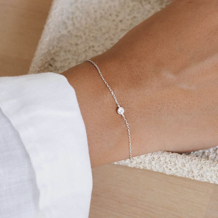 A dainty silver chain bracelet with a hand-set white topaz gemstone. This bracelet has a sliding bead so you can adjust it to your wrist. Will fit wrists up to 6.75" in circumference. Dainty Jewelry Silver, Simplistic Jewelry, Dainty Gold Chain, Simple Silver Jewelry, Gold Chain Bracelet, Silver Bracelets For Women, Wrist Jewelry, Simple Bracelets, Silver Chain Bracelet