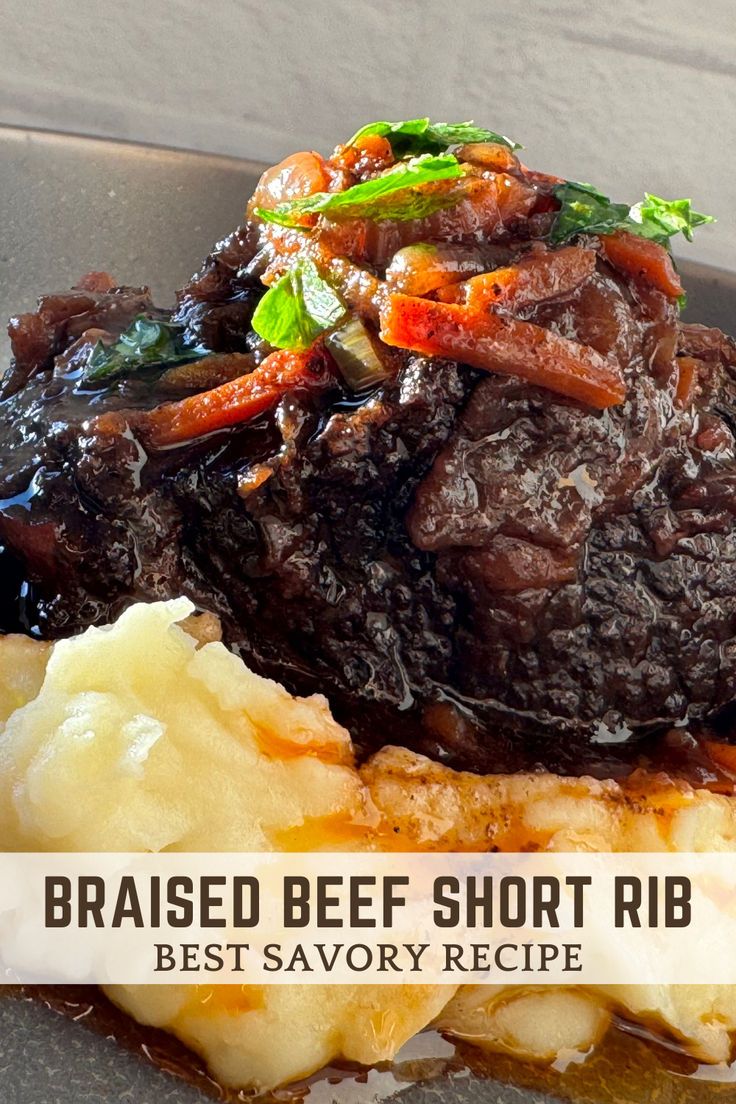 a close up of food on a plate with the words braised beef short rib