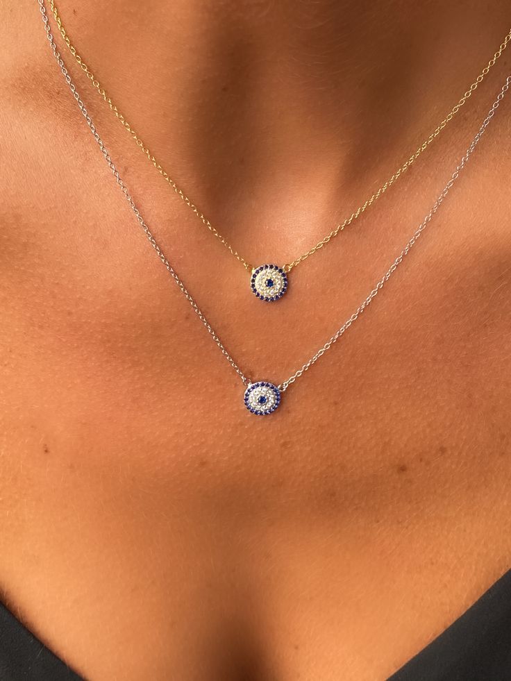 Layering our dainty lucky Evil Eye Disc necklaces in silver & gold. Shop alexandramarksjewelry.com #necklace #evileyejewelry #evileyenecklace #evileye #necklace #necklaceoftheday #goodvibes #bohostyle #boho #bohochic #lucky #goodluckcharm #giftguide #giftforher #eye #accessories #jewelry #affordablefashion #affordable Blue Trendy Jewelry With Delicate Chain, Everyday Round Evil Eye Jewelry, Everyday Blue Tarnish-resistant Jewelry, Blue Necklaces With Diamond Eyes As Gift, Everyday Evil Eye Charm Necklace, Trendy Evil Eye Jewelry Gift, Dainty Evil Eye Round Pendant Necklace, Blue Necklace With Diamond Eyes As Gift, Trendy Everyday Evil Eye Jewelry