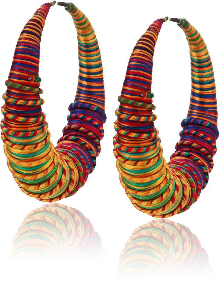 The Miriam Hoops are traditional earrings hand made by artisans in Gambia using traditional techniques exclusive to the artisans know as the Tegaa. These crafting techniques are only accessed within this artisan group and passed down through generations. The hoops are hand-wrapped in multi-color dyed eco-silk threads with spiral detailing. Pair with the matching stackable Rohey cuff for sustainable resortwear at it's finest! Hand made in Gambia Eco-friendly & sustainable 5% of proceeds donated t Traditional Earrings, Hand Wrap, Silk Thread, Traditional Techniques, Resort Wear, Royal Blue, Hand Made, Multi Color, Dye