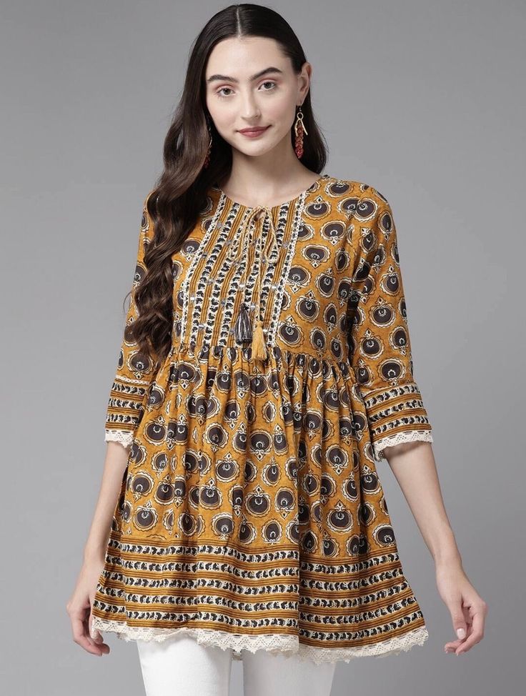 * Women Mustard Pure Cotton Floral Print Round Collar Tunic Printed Kurti / Embroidered Short Kurti / Indian Tunic / Summer-Spring Evening Dress / Cotton Tunic Tops * Mustard printed tunic ,has a round neck, three-quarter sleeves, tie-ups detail *Fabric:- 100% Cotton  *Wash Care:- MACHINE WASH AVAILABLE IN 6 SIZES THEY ARE IN FOLLOWING MEASUREMENTS IN INCHES:- XS:- Bust-34/Waist In-30/Length-34 S:- Bust-36/Waist In-32/Length-34 M:- Bust-38/Waist In-34/Length-34 L:- Bust-40/Waist In-36/Length-34 Tunics For Women Indian, Neck Design Ideas, Tunic Tops Outfit, Top Designs For Women, Cotton Short Tops, Yellow Color Combinations, Kurti Sleeves, Kurti Top, Design Kurta