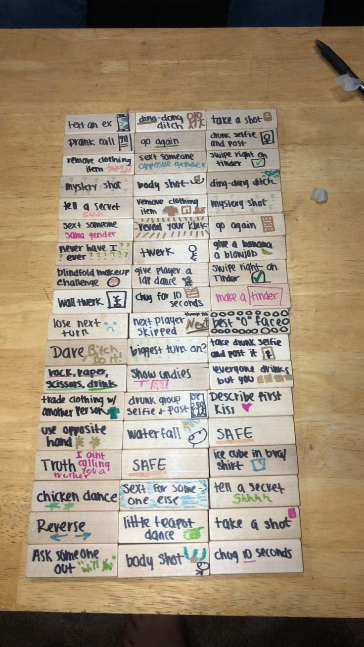 a wooden table topped with lots of writing