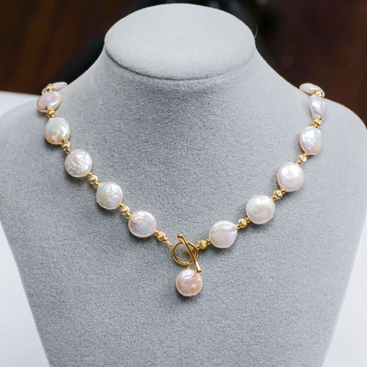 Celebrate your love for all things vintage with this handmade baroque pearl matching set. Each shimmering white cultured pearl features a unique shape, making these pearls a true treasure from the sea to cherish. Shiny, rich yellow gold plated spacer beads interplay with the pearls, creating a fusion of classic meets trendy style. Elongated hook clasps close the necklace, adding a luxurious touch. Created with an antique inspiration, purchase this set together or separately and showcase their el Luxury Elegant Baroque Pearl Beaded Necklaces, Gold Pearl Toggle Necklace, Gold Pearl Necklace With Toggle Clasp, Coin Pearl Necklace, Button Necklace, Toggle Necklace, Necklace Patterns, Baroque Pearl Necklace, Coin Pearls