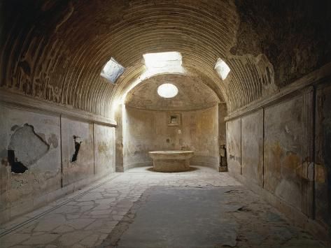 an old tunnel with a bathtub in the middle and two lights on either side