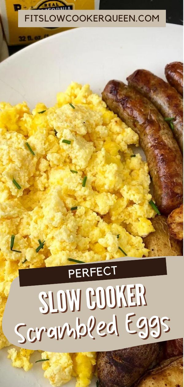 the perfect slow cooker scrambled eggs on a white plate with sausages and potatoes