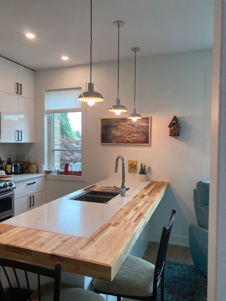 Butcher block wraparound countertop extension for added workspace and seating. Stone And Butcher Block Countertop, Granite And Butcher Block Countertops, Quartz And Butcher Block Countertops, Butcher Block Peninsula, Butcher Block And Quartz Countertops, Kitchen Countertop Extension, Counter Extension, Visualization Manifestation, Kitchen Butcher Block