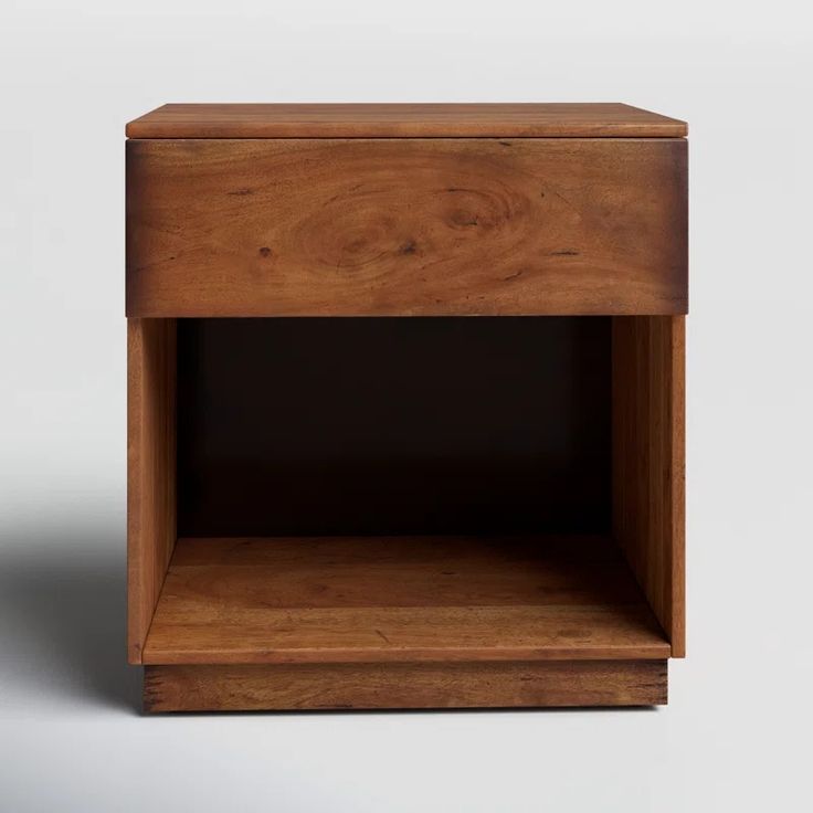 a small wooden shelf with one drawer open and the other closed on it's side