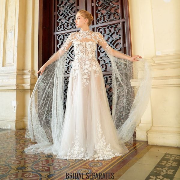 a woman in a white wedding dress standing by a door