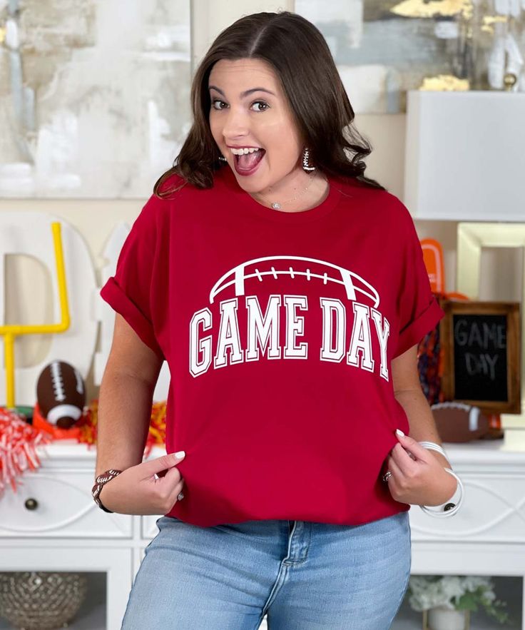 Introducing our "Game Day Football Graphic Tee Shirt," the ultimate choice for football fans looking to show their team spirit. Available in sizes S through 5XL, this shirt features a crisp white design on your team color of choice, making it perfect for game day, tailgates, and Friday night lights.
Crafted from high-quality, soft materials, this shirt ensures all-day comfort, whether you're cheering from the stands, enjoying a tailgate party, or watching the game with friends. The "Game Day Foo Pre-shrunk Fan Apparel T-shirt For Game Day, Baseball Season Game Day Fan Apparel T-shirt, Pre-shrunk Sports Fan T-shirt For Game Day, Short Sleeve Tops For Game Day With School Spirit, Short Sleeve Tops For Game Day School Spirit, Football Season Fan Gear Graphic Tee, Football Season Graphic Tee Fan Gear, Football Season Fan Merchandise Tops, Fan Merchandise Tops For Football Season