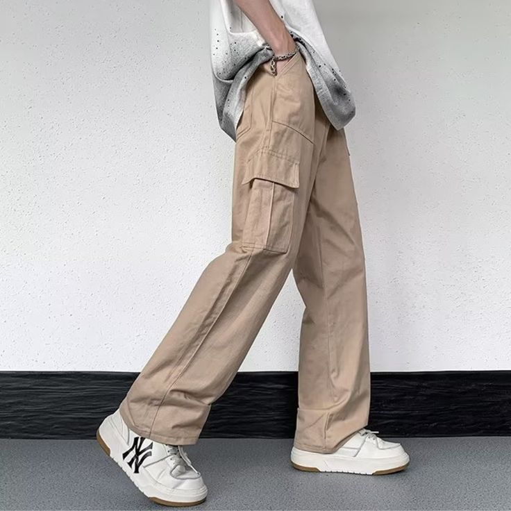 Our Casual Literary Straight Cargo Pants are an essential piece for any stylish look. Boasting a sophisticated solid color and deep pocket detail, these premium pants are the perfect balance of casual and literary. Ideal for any occasion, you'll feel both comfortable and confident in these urban-chic trousers. Features: -100% Cotton -Mid-rise waist -Solid Color -Straight Leg -Regular Fit -Casual style Casual Cargo Pants With Patch Pockets, Casual Straight Leg Cargo Pants With Multiple Pockets, Straight Leg Chinos With Cargo Pockets For Streetwear, Baggy Cargo Pants In Solid Color, Urban Chinos With Pockets For Streetwear, Solid Color Pants With Patch Pockets For Streetwear, Urban Solid Pants With Cargo Pockets, Casual Khaki Straight Cargo Jeans, Casual Khaki Cargo Jeans With Straight Fit