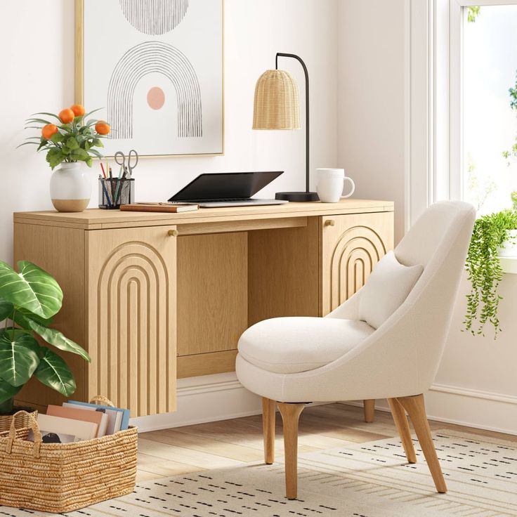 a white chair sitting in front of a wooden desk