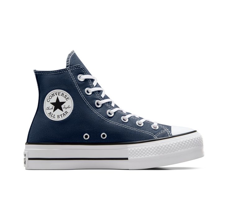 Classic Chucks, leveled up. The Chuck Taylor All Star has morphed since its creation in 1917. Still, despite the everchanging landscape of fashion and decades’ worth of trends, the everyday icon lives on. A simple design, a timeless silhouette, an unmistakable ankle patch— something familiar for every iteration of you, no matter where your style might lead you next. Converse Chuck Taylor All Star Lift Platform Canvas For Women In Indigo, Size 8 Navy Blue Converse, Navy Converse, Weightlifting Shoes, Platform Chucks, Custom Chuck Taylors, Womens High Top Shoes, Converse Platform, Chuck Taylor All Star Lift, Shoe For Women