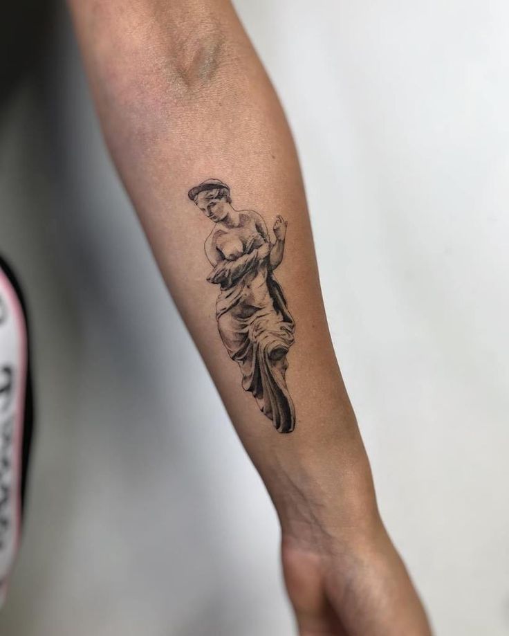 a person with a tattoo on their arm