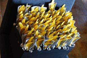 a bunch of yellow scissors sitting in a black case