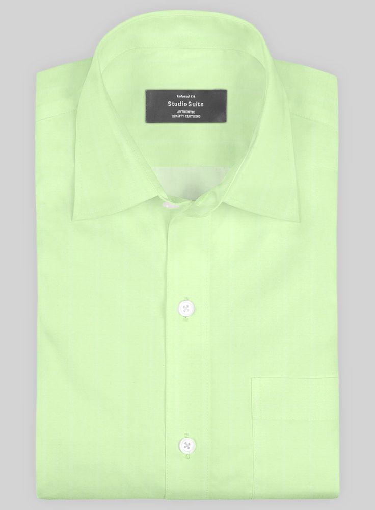 Evoke the appealing chic stance through our Italian Lombardo Mint Green Shirt. Further, crafted from pure cotton fabric, which exhibits a delicate, sleek and evenly smooth, aligning a solid finish over green hues.  And finally, draw the striking looks with a skillfully tailored shirt that gives off a relaxed fit with timeless tones that instantly elevate the stylish flair to turn up with our shirt for day-to-day duties and special occasions.  Made according to your measurements for the special y Fitted Green Modern Tops, Modern Fitted Green Tops, Elegant Green Summer Shirt, Elegant Green Shirt With Spread Collar, Classic Green Shirt For Work, Classic Green Office Shirt, Green Cotton Business Shirt, Green Slim Fit Shirt For Work, Green Slim Fit Workwear Shirt