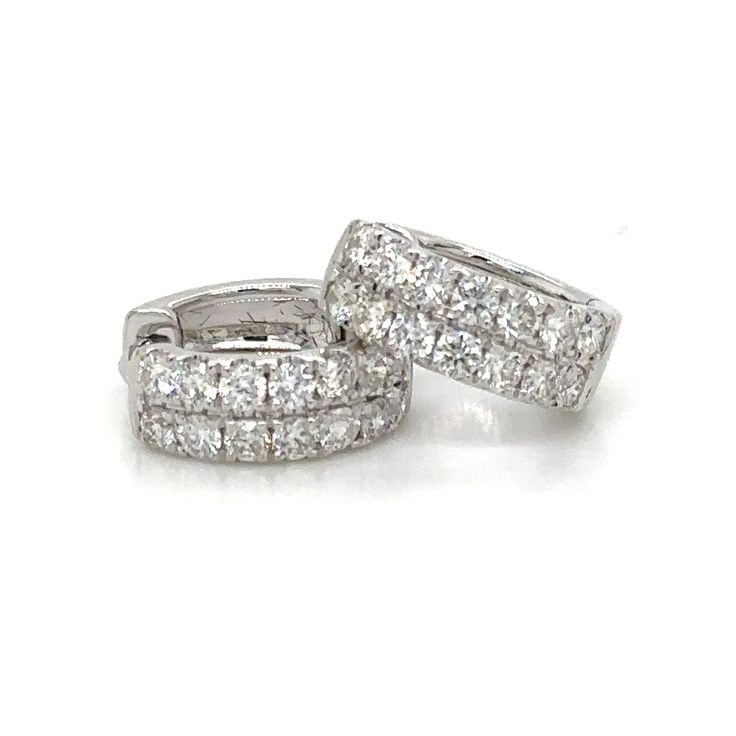 Treat yourself to our two row pave diamond huggie earrings and add some sparkle to your dazzling look. Crafted with 0.71ct t.w. genuine diamonds, these earrings are certain to make a statement! Make your style unforgettable with this beautiful, timeless piece of jewelry. Metal: 18K White GoldDiamond Shape: Round Brilliant CutsDiamond Weight: (28) Diamonds 0.71ct t.w.Width: 5mm x 13mm Estimated production time is 4 - 5 weeks. White Huggie Earrings With Pave Setting For Anniversary, White Diamond Huggie Earrings With Pave Setting, White Pave Setting Huggie Earrings, White Huggie Earrings With Pave Setting, Diamond Huggie Earrings With Pave Setting For Anniversary, White Diamond Accented Huggie Earrings, White Diamond Huggie Earrings With Accents, Wedding Huggie Earrings With Pave Setting, White Diamond Accent Huggie Earrings