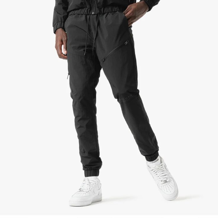 Super Lightweight Windbreaker Pants Hidden Zipper Pocket Drawstring Waist (2) Hand Pockets Elastic Ankle Model Height: 6'0" Model Weight: 160 lbs Size Worn: Medium * Runs Small, Recommend 1 Size Up* Life Code, 170 Lbs, Windbreaker Pants, Velcro Straps, Jogger Pants, Model Height, Hidden Zipper, Drawstring Waist, Black Pants