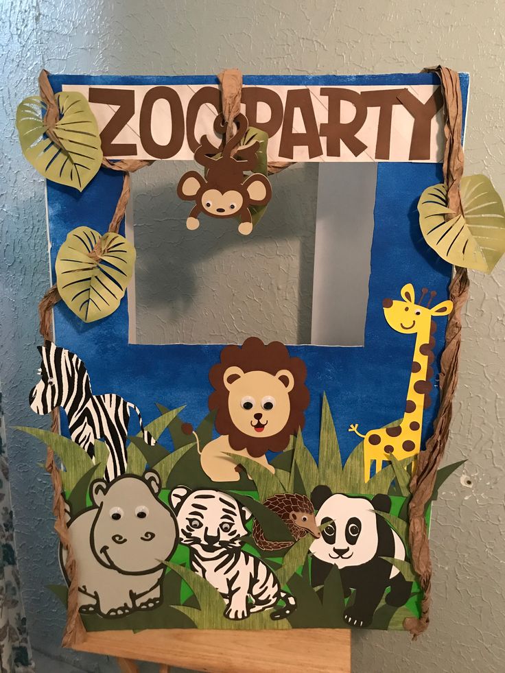 an animal themed zoo party is hanging on the wall in front of a mirror that says,'zoo party '