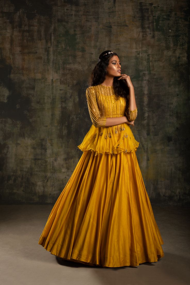 #fashion #design #designer #yellow #peplum #indianfashion #monaandvishu Blouse Peturn, Yellow Gharara, Haldi Dress Ideas, Mayon Dresses, Diwali Outfit, Cape Lehenga, Haldi Ceremony Outfit, Haldi Dress, Long Blouse Designs