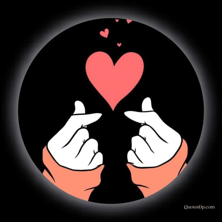 two hands holding a heart in the middle of a black circle with pink hearts on it