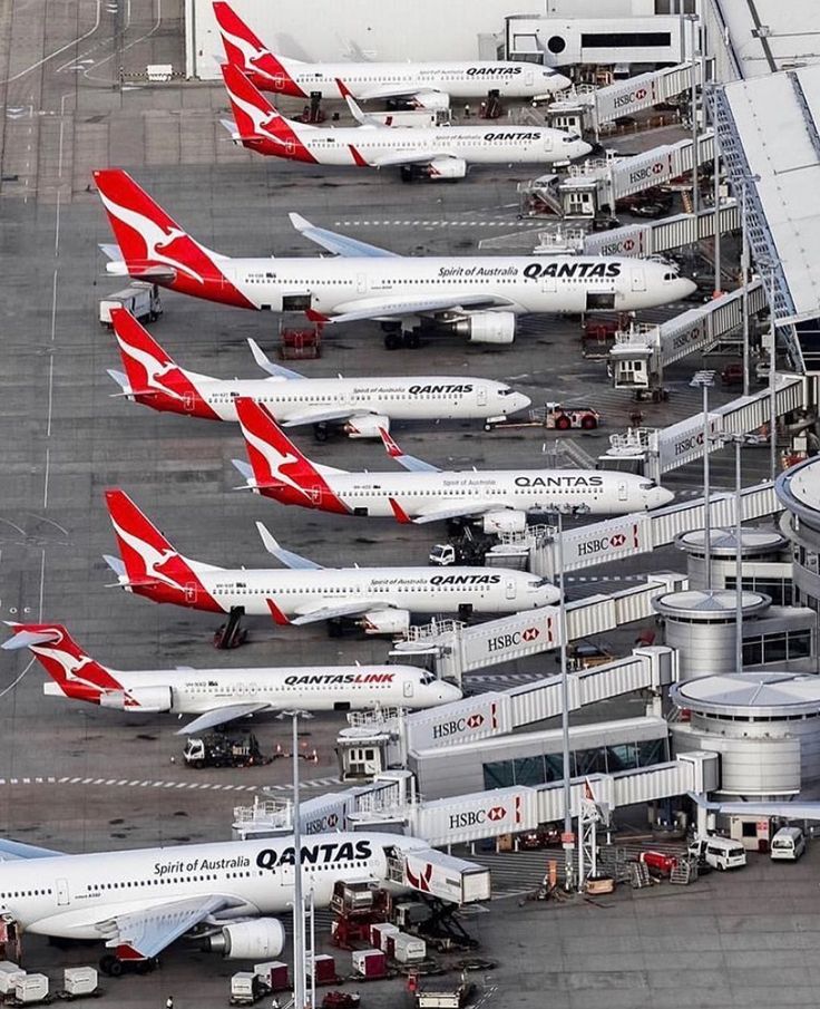 several airplanes are parked on the tarmac at an airport