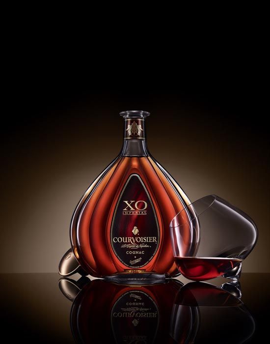 a bottle of courvoisier is shown with its reflection