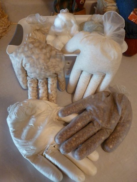 several gloves are laid out on the table to be used as decorations or for decorating