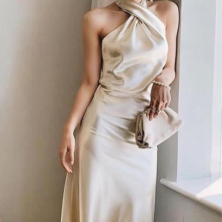 Beige Cross Halter Neck Midi Dress (Elegant) Chic Spring Midi Dress With Crisscross Straps, Chic Midi Dress With Crisscross Straps For Spring, Feminine Midi Length Halter Dress, Chic Beige Midi Dress For Wedding, Beige Halter Neck Party Dress, Chic Beige Halter Neck Dress, Chic Beige Midi Dress For Wedding Guest, Chic Sleeveless Halter Dress For Wedding Guest, Chic Halter Neck Maxi Dress For Wedding Guest