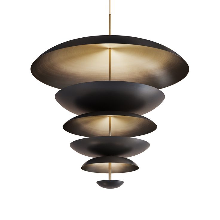 three black and gold lights hanging from the ceiling