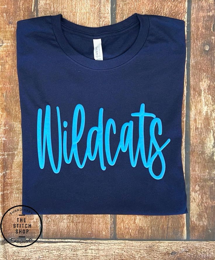 This is made with 3D puff vinyl on a comfort colors tee. They are 100% cotton and soft. Blue School Spirit T-shirt With Text Print, Casual T-shirt With Lettering For Fans, Casual Fan Merchandise T-shirt With Lettering, Sporty Blue T-shirt With Lettering, Blue T-shirt With School Spirit Print, Blue Graphic Tee With Lettering, Team Spirit Cotton T-shirt With Heat Transfer Vinyl, Cotton Team Spirit T-shirt With Heat Transfer Vinyl, Casual Tops With Fan Gear Lettering