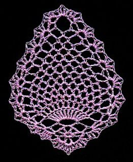 an intricately designed doily is shown on a black background in this image, it appears to be pink