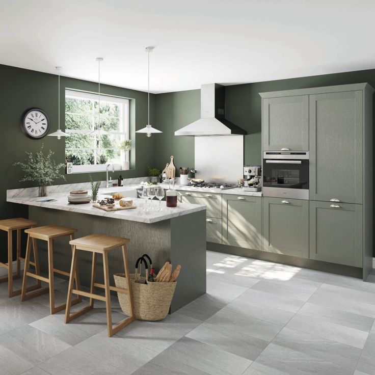 a kitchen with green walls and white counter tops