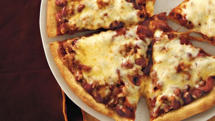 a white plate topped with four slices of pizza