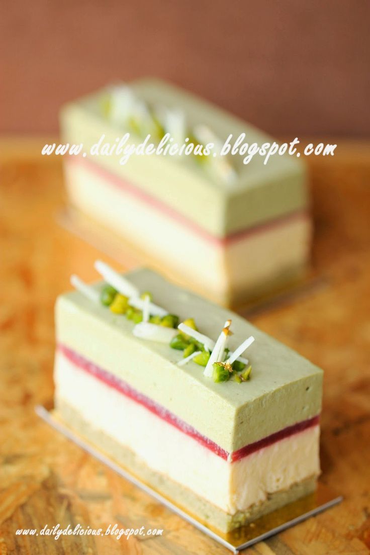 two pieces of cake sitting on top of a wooden table