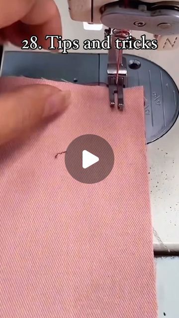 someone is using a sewing machine to sew the fabric on a piece of cloth