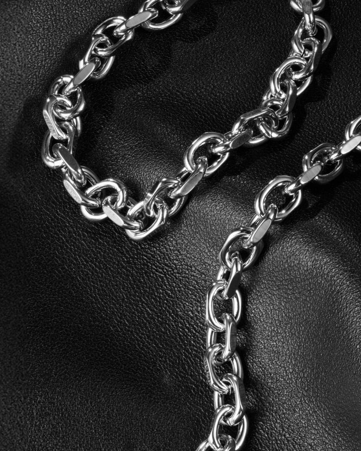 Cast and tethered by a forge, bearing links to charm all. Wear this sleek, versatile cable chain bracelet on its own or imbue it with your essence by adorning it with your favourite charms from The Charm Lab series. Each link in the Catalyst Chain Bracelet is meticulously carved with chiselled edges, embodying a versatile, genderless appeal. Complete your look with other jewelry from the Catalyst series. Sold Individually. Each piece is lovingly crafted by hand, under ethical working conditions. Silver Chain Link Bracelet For Everyday, White Gold Link Chain Bracelet With Chunky Chain, White Gold Chunky Chain Link Bracelet, White Gold Chunky Link Chain Bracelet, Modern Charm Bracelet With Cable Chain Links, Silver Cable Chain Metal Bracelets, Everyday Charm Bracelet With Cable Chain, Minimalist Charm Bracelet With Solid Link Chain, Minimalist Charm Bracelet With Chain Link