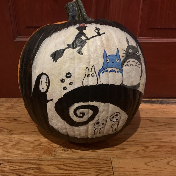 a pumpkin decorated with an image of various characters