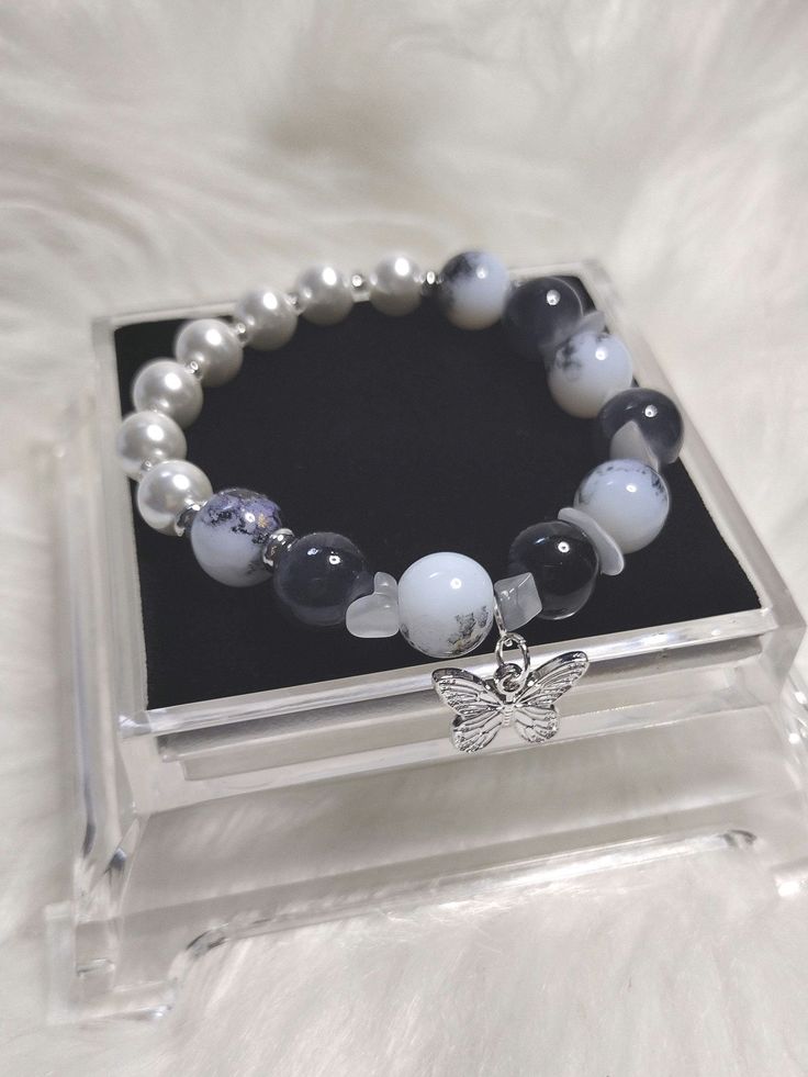 Monochrome Elegance Bracelet with Glass Beads, Gemstone Chipstone Beads, and White Pearl Glass Beads . Glass Seed's Beads and Silver Charm. Silver Beaded Pearl Stretch Bracelet, White Pearl Beaded Charm Bracelet, White Beaded Pearl Charm Bracelet, Adjustable Beaded Pearl Charm Bracelet, Silver Beaded Pearl Bracelets, Pearl Beaded Bracelets With Silver Beads, Adjustable Pearl Bracelets With Gemstone Beads, Silver Pearl Bracelets With Colorful Beads, Silver Pearl Beaded Bracelets With Colorful Beads