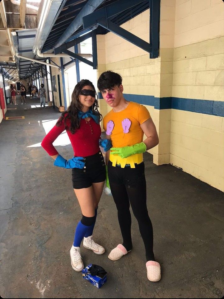 two people in costumes standing next to each other