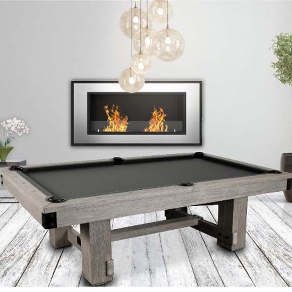 a pool table in a room with white walls and wood flooring that has a chandelier hanging from the ceiling