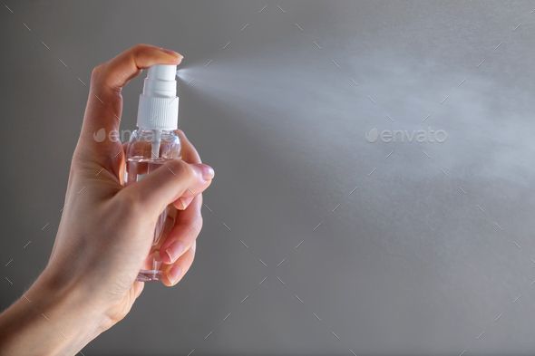 Girl applying spray disinfectant alcohol product on hand by byrdyak. Female person woman or girl applying spray disinfectant alcohol product on hand disinfecting hands against virus bact... #AD #product, #alcohol, #byrdyak, #hand Minimalist Skincare, Blog Designs, Fire Extinguishers, Disaster Preparedness, Acne Blemishes, Ask For Help, Fashion Website, Website Templates, Natural Disasters