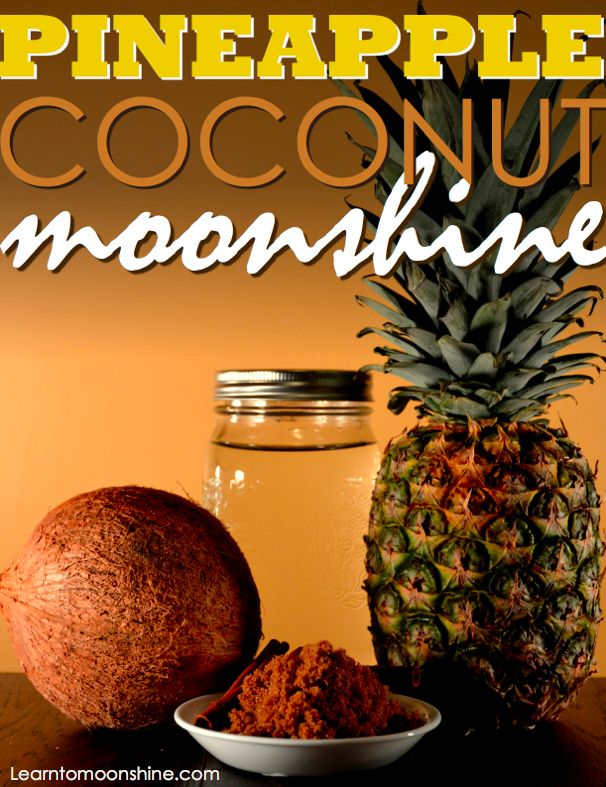 a pineapple and coconut smoothie sitting on top of a wooden table next to a jar