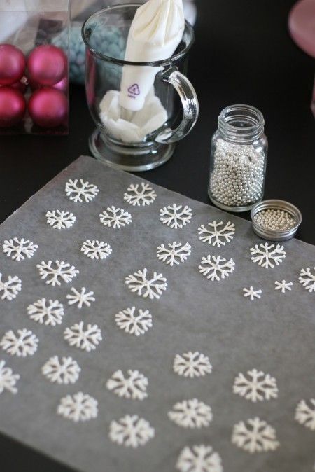 the table is covered with snowflakes and other decorations