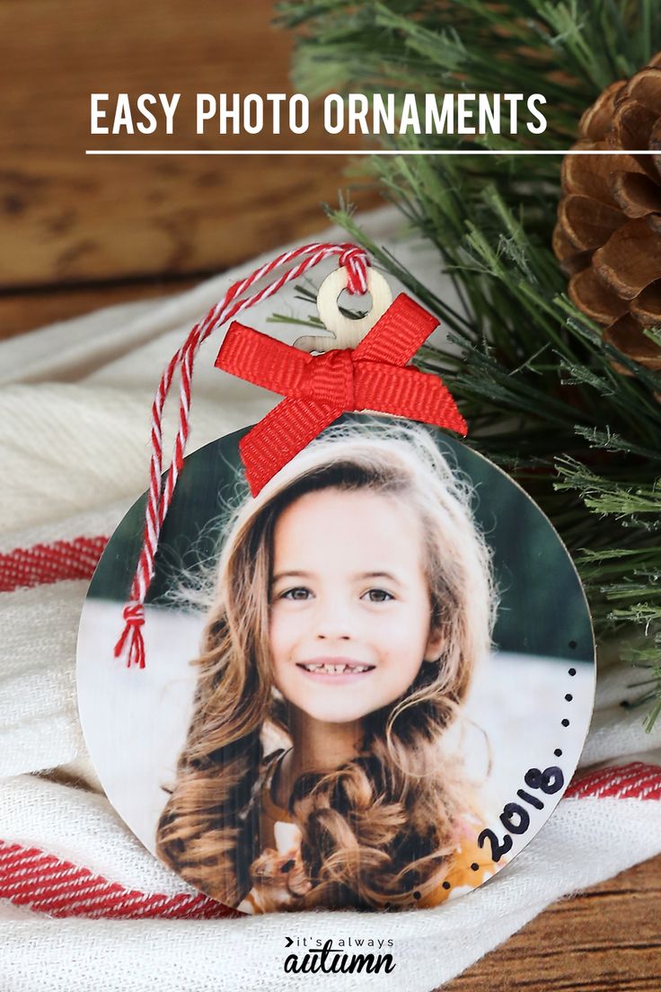 an ornament hanging from a christmas tree with the words easy photo ornaments on it